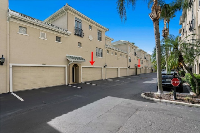 501 Knights Run Ave Unit 5103, Tampa, FL 33602 - view of asphalt road featuring a residential view and curbs