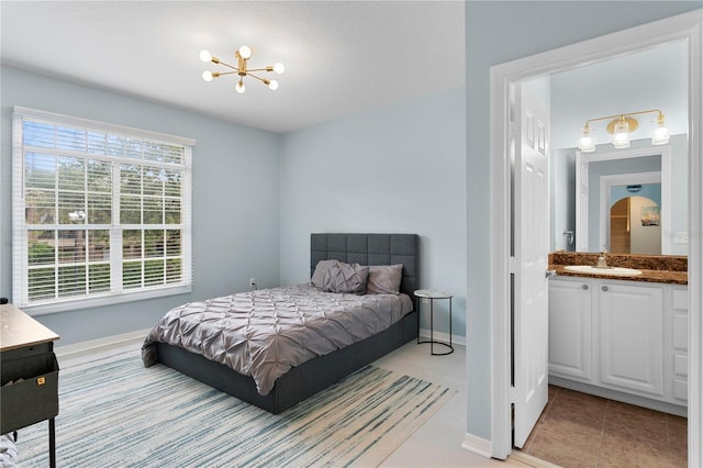 501 Knights Run Ave Unit 5103, Tampa, FL 33602 - bedroom with a sink, a chandelier, and baseboards