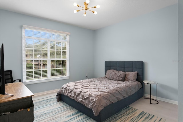 501 Knights Run Ave Unit 5103, Tampa, FL 33602 - bedroom with a chandelier and baseboards