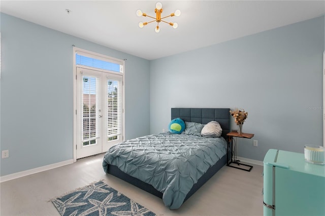 501 Knights Run Ave Unit 5103, Tampa, FL 33602 - bedroom featuring a chandelier, access to exterior, french doors, baseboards, and wood finished floors
