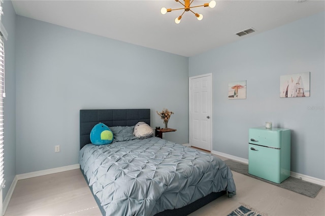 501 Knights Run Ave Unit 5103, Tampa, FL 33602 - bedroom with a chandelier and baseboards
