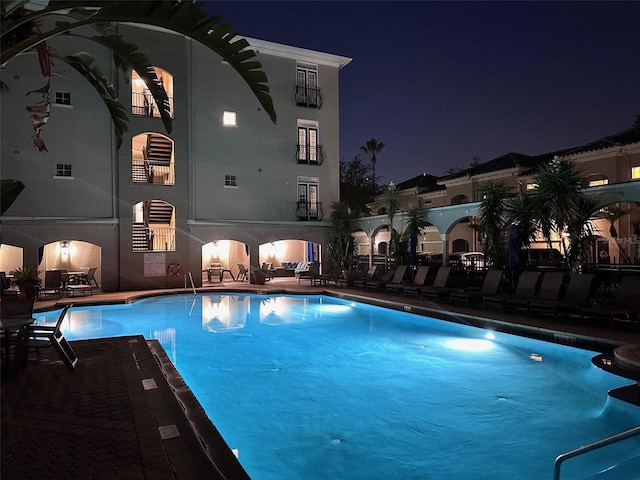 501 Knights Run Ave Unit 5103, Tampa, FL 33602 - pool at twilight with a community pool and a patio