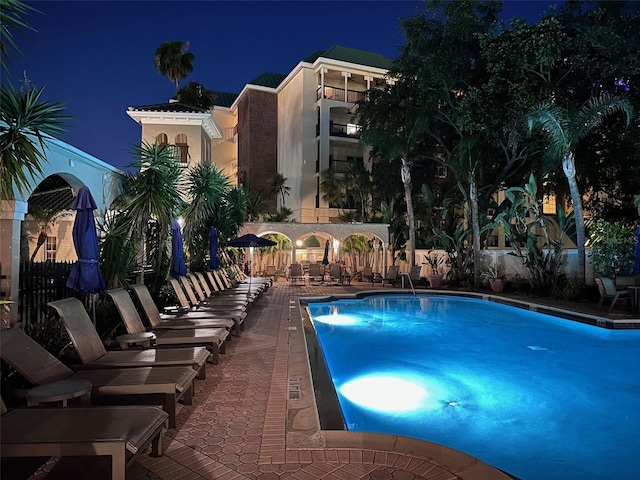 501 Knights Run Ave Unit 5103, Tampa, FL 33602 - pool at night featuring a community pool and a patio area