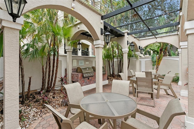 501 Knights Run Ave Unit 5103, Tampa, FL 33602 - view of patio featuring outdoor dining space and a pergola