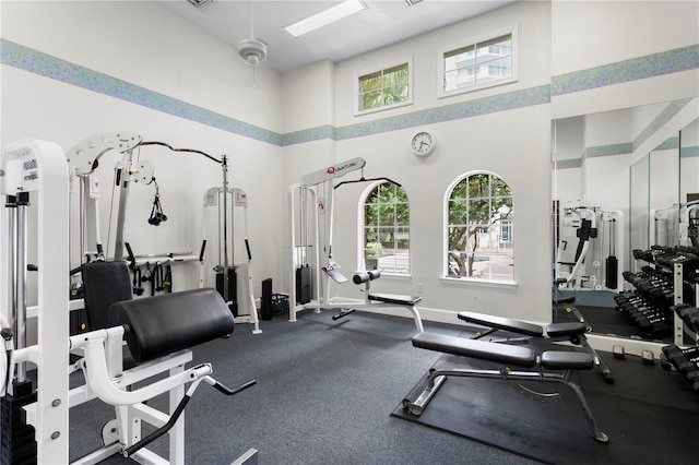 501 Knights Run Ave Unit 5103, Tampa, FL 33602 - gym with a high ceiling, healthy amount of natural light, and baseboards