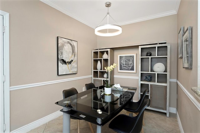 2705 Via Murano Unit 127, Clearwater, FL 33764 - dining room with crown molding, baseboards, and light tile patterned flooring