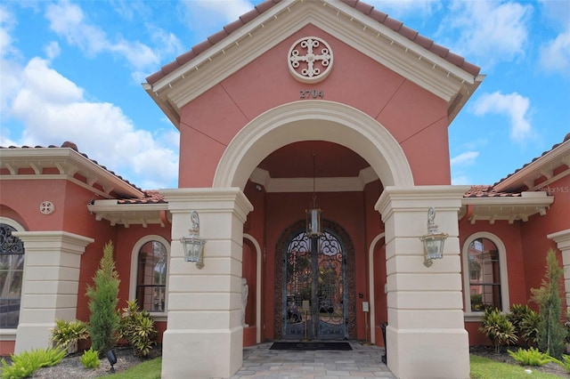 2705 Via Murano Unit 127, Clearwater, FL 33764 - doorway to property with french doors and stucco siding
