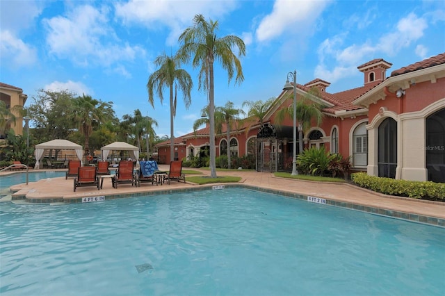 2705 Via Murano Unit 127, Clearwater, FL 33764 - community pool with a patio area