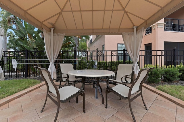 2705 Via Murano Unit 127, Clearwater, FL 33764 - view of patio / terrace with a gazebo and outdoor dining area