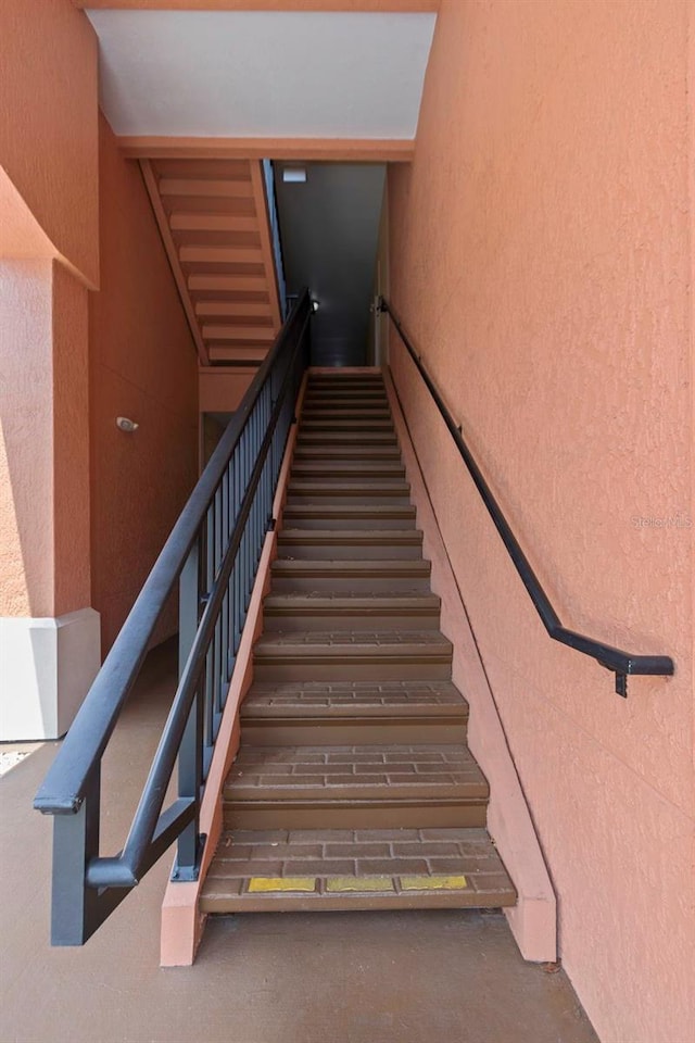 2705 Via Murano Unit 127, Clearwater, FL 33764 - stairway with a textured wall