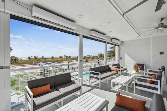 11500 Gulf Blvd Unit 513, Treasure Island, FL 33706 - view of patio / terrace featuring an outdoor living space, a wall unit AC, and a ceiling fan