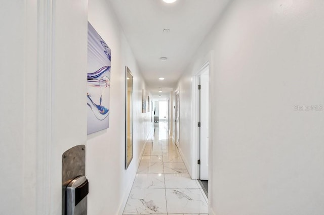 11500 Gulf Blvd Unit 513, Treasure Island, FL 33706 - hallway with light marble finish floors, baseboards, and recessed lighting