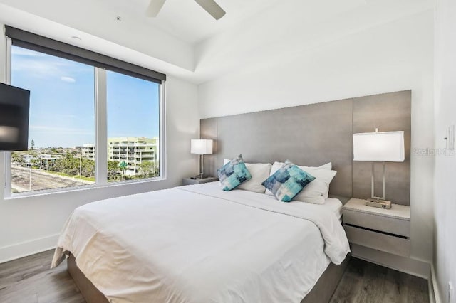 11500 Gulf Blvd Unit 513, Treasure Island, FL 33706 - bedroom featuring wood finished floors, multiple windows, and baseboards
