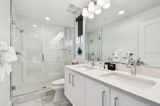 11500 Gulf Blvd Unit 513, Treasure Island, FL 33706 - full bathroom featuring marble look tiles, a shower stall, toilet, double vanity, and recessed lighting
