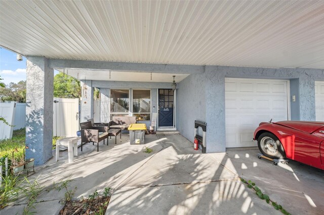 108 Shore Dr, Tarpon Springs, FL 34689 - view of patio / terrace featuring outdoor lounge area and a garage