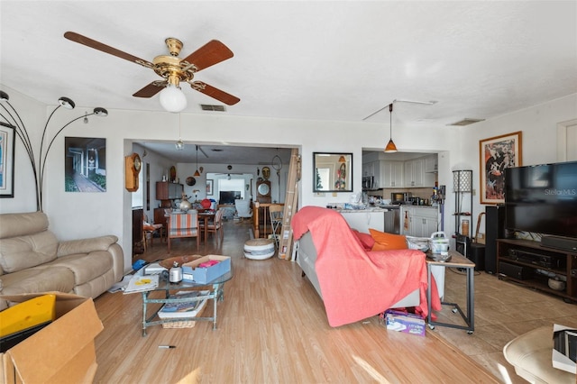 108 Shore Dr, Tarpon Springs, FL 34689 - living room featuring ceiling fan and light wood-style flooring