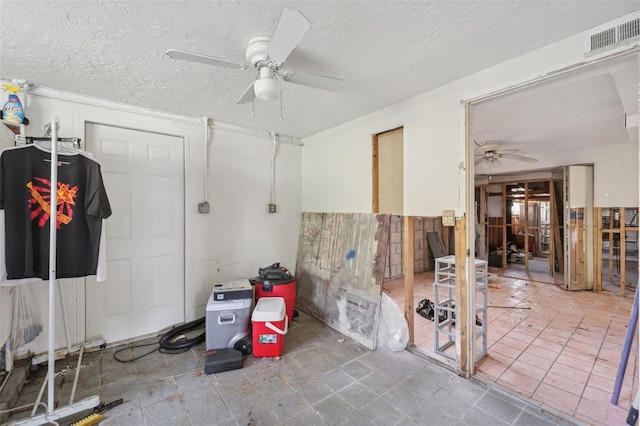 108 Shore Dr, Tarpon Springs, FL 34689 - misc room featuring ceiling fan and a textured ceiling