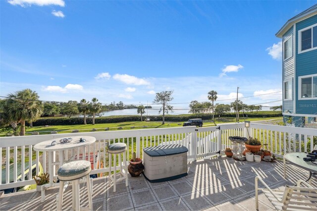 108 Shore Dr, Tarpon Springs, FL 34689 - wooden terrace with a water view