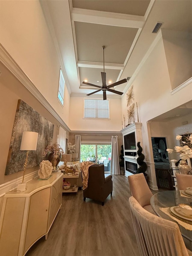 5332 Riverwalk Preserve Dr, New Port Richey, FL 34653 - living room with a high ceiling, a ceiling fan, coffered ceiling, wood finished floors, and beam ceiling