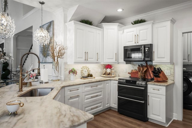5332 Riverwalk Preserve Dr, New Port Richey, FL 34653 - kitchen featuring double oven range, a sink, white cabinets, light stone counters, and ornamental molding