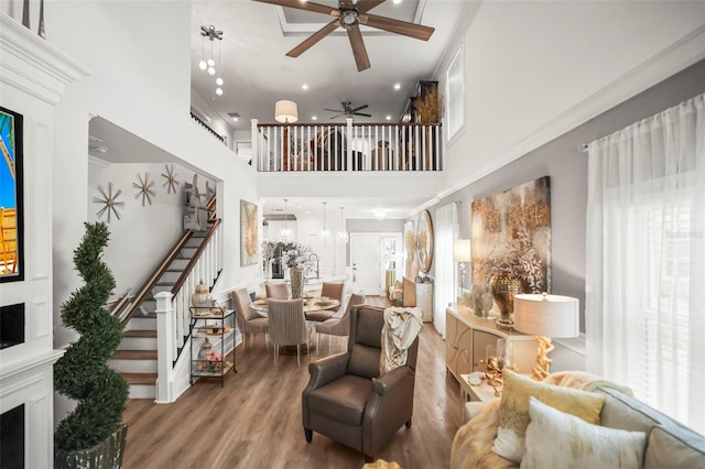 5332 Riverwalk Preserve Dr, New Port Richey, FL 34653 - living room featuring a ceiling fan, stairs, a high ceiling, wood finished floors, and recessed lighting