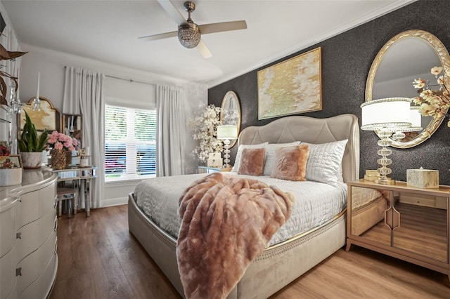 5332 Riverwalk Preserve Dr, New Port Richey, FL 34653 - bedroom with wood finished floors, ornamental molding, and ceiling fan