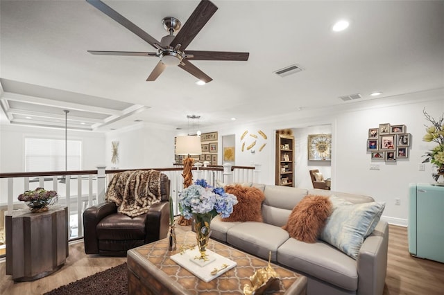 5332 Riverwalk Preserve Dr, New Port Richey, FL 34653 - living area with wood finished floors, ceiling fan, ornamental molding, and recessed lighting
