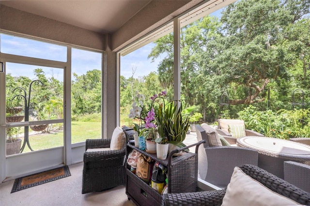 5332 Riverwalk Preserve Dr, New Port Richey, FL 34653 - sunroom / solarium with view of scattered trees and an outdoor living space