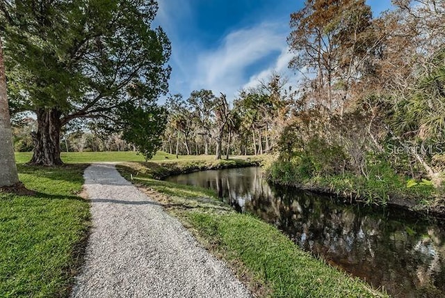 5332 Riverwalk Preserve Dr, New Port Richey, FL 34653 - view of community with a yard and a water view