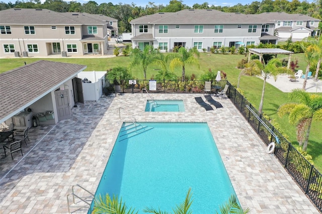 5332 Riverwalk Preserve Dr, New Port Richey, FL 34653 - community pool with a residential view, a hot tub, and a patio area