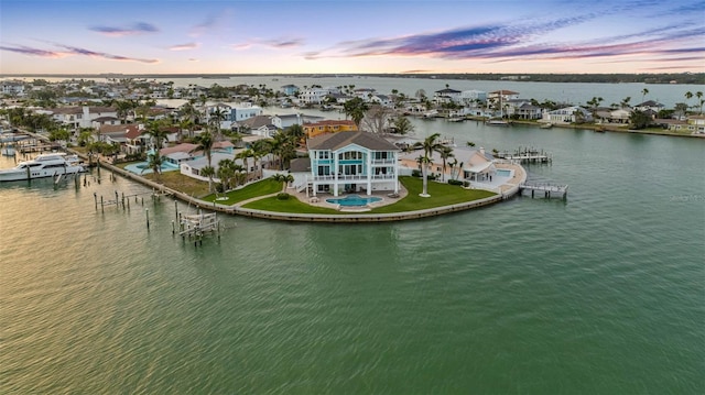 11000 8th St E, Treasure Island, FL 33706 - aerial view at dusk of a water view