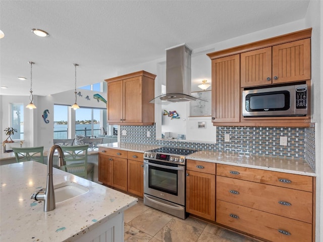 11000 8th St E, Treasure Island, FL 33706 - kitchen with stainless steel appliances, island range hood, backsplash, hanging light fixtures, and light stone counters