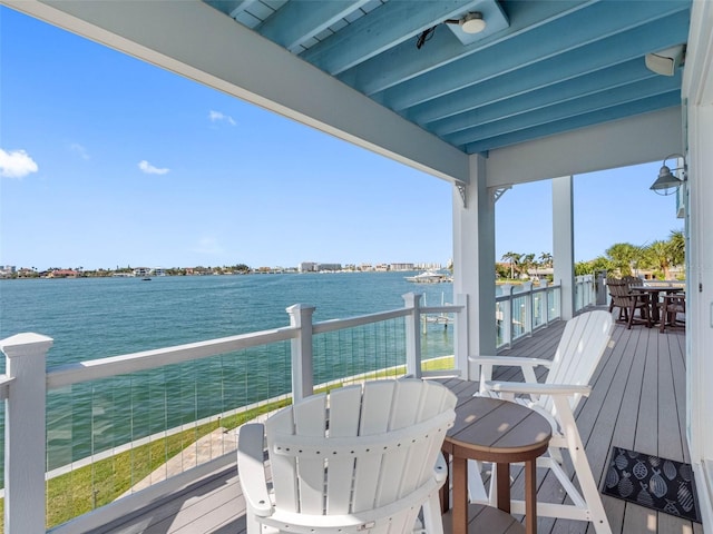 11000 8th St E, Treasure Island, FL 33706 - deck featuring a water view and outdoor dining space
