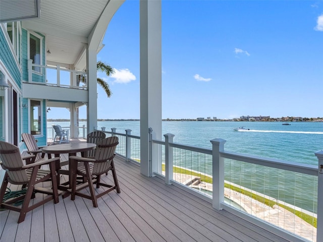 11000 8th St E, Treasure Island, FL 33706 - wooden deck featuring a water view