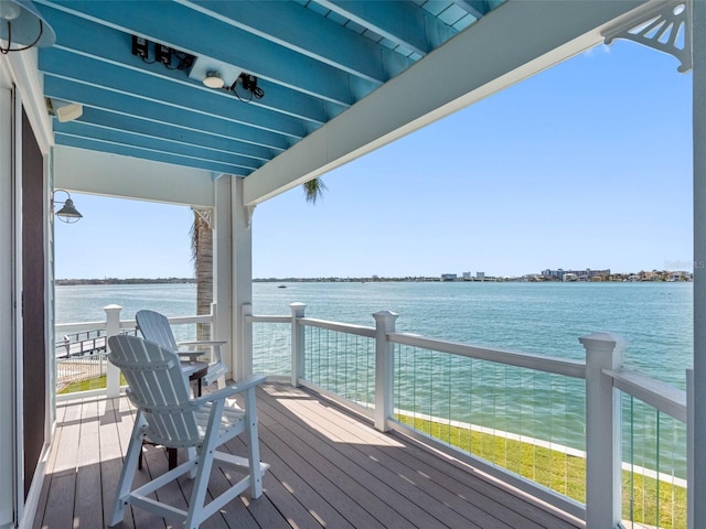 11000 8th St E, Treasure Island, FL 33706 - wooden deck featuring a water view