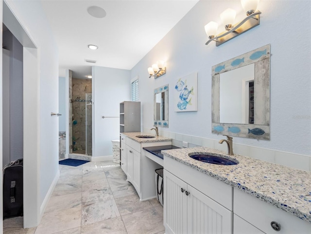 11000 8th St E, Treasure Island, FL 33706 - bathroom featuring a stall shower and two vanities