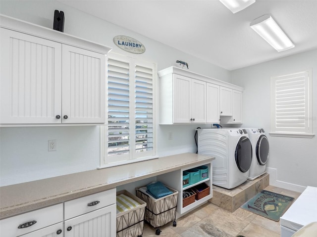 11000 8th St E, Treasure Island, FL 33706 - washroom with washing machine and clothes dryer and cabinet space