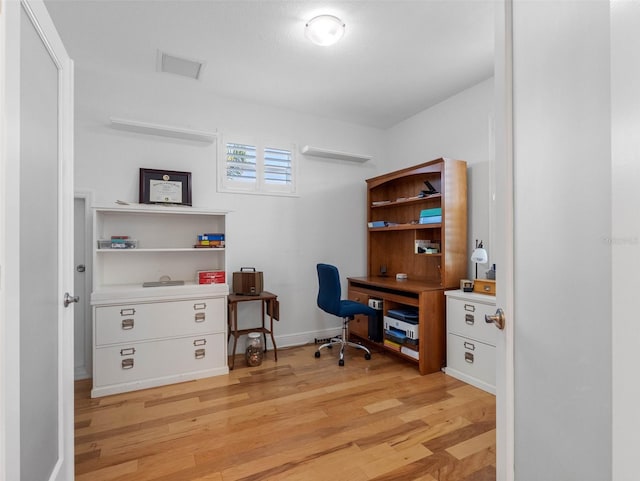 11000 8th St E, Treasure Island, FL 33706 - office area featuring light wood-type flooring and baseboards