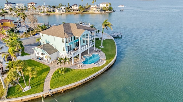 11000 8th St E, Treasure Island, FL 33706 - aerial perspective of suburban area featuring a nearby body of water and a pool area