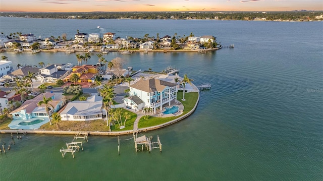 11000 8th St E, Treasure Island, FL 33706 - aerial view of residential area with a nearby body of water