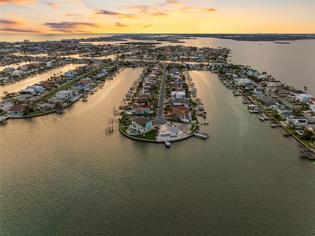 11000 8th St E, Treasure Island, FL 33706 - aerial view at dusk of a water view and a residential view