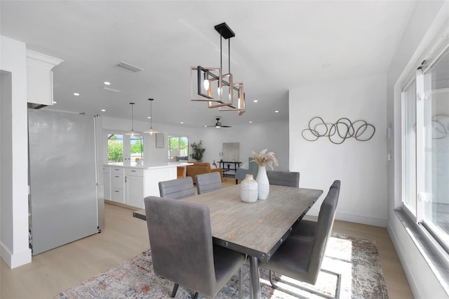 6508 Senegal Palm Way, Apollo Beach, FL 33572 - dining room with light wood finished floors, baseboards, recessed lighting, and a ceiling fan
