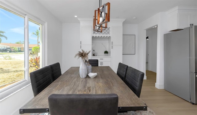 6508 Senegal Palm Way, Apollo Beach, FL 33572 - dining area with light wood-type flooring and recessed lighting