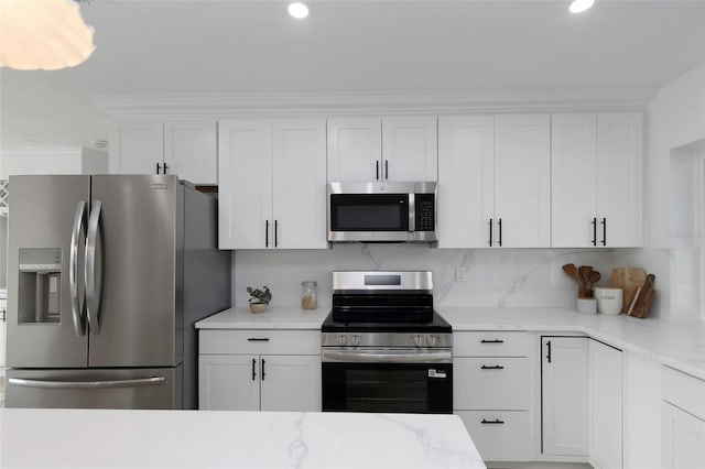 6508 Senegal Palm Way, Apollo Beach, FL 33572 - kitchen featuring stainless steel appliances, white cabinetry, recessed lighting, backsplash, and light stone counters