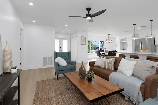 6508 Senegal Palm Way, Apollo Beach, FL 33572 - living room with light wood-type flooring, recessed lighting, ceiling fan, and baseboards
