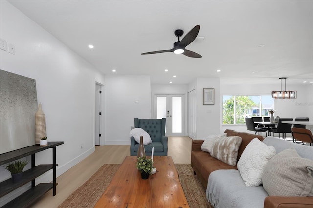 6508 Senegal Palm Way, Apollo Beach, FL 33572 - living room featuring ceiling fan, light wood finished floors, recessed lighting, baseboards, and french doors