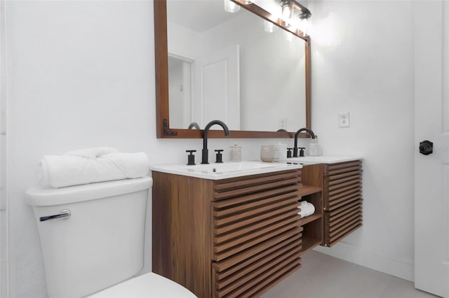 6508 Senegal Palm Way, Apollo Beach, FL 33572 - bathroom featuring toilet, double vanity, and baseboards