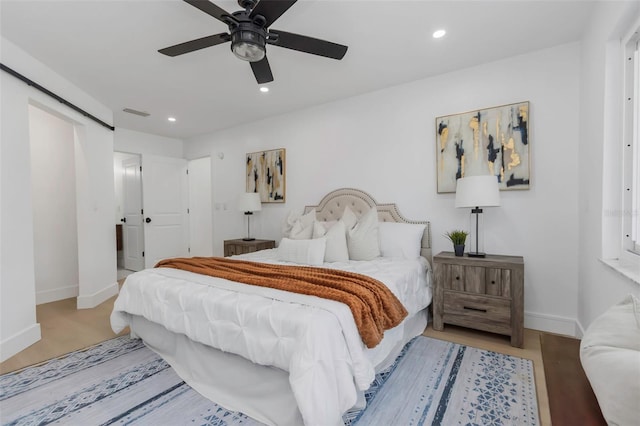 6508 Senegal Palm Way, Apollo Beach, FL 33572 - bedroom with baseboards, recessed lighting, ceiling fan, and wood finished floors