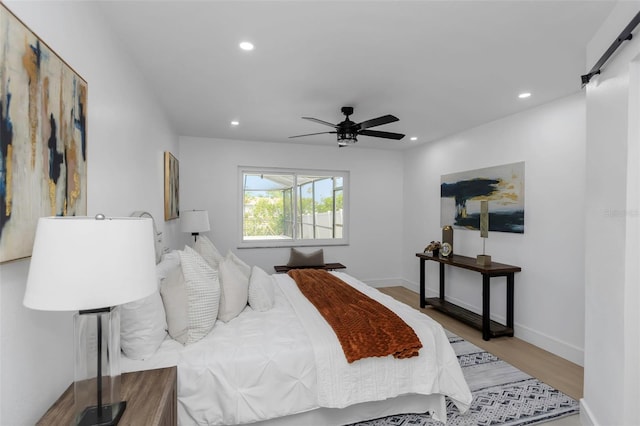 6508 Senegal Palm Way, Apollo Beach, FL 33572 - bedroom featuring wood finished floors, recessed lighting, a ceiling fan, and baseboards
