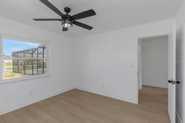 6508 Senegal Palm Way, Apollo Beach, FL 33572 - empty room with light wood-type flooring, baseboards, and ceiling fan